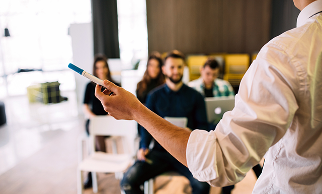 Class Setting with Teacher in Front of Students